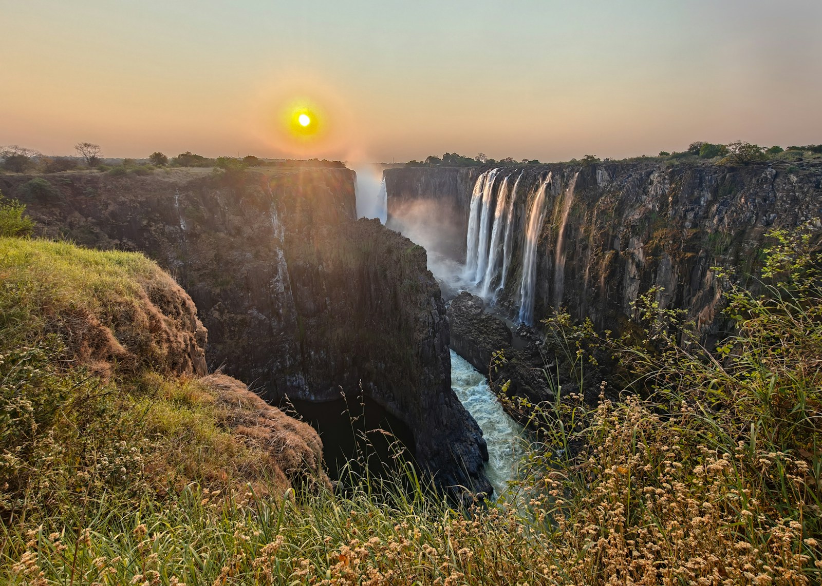 Golden evening light above Victoria Falls